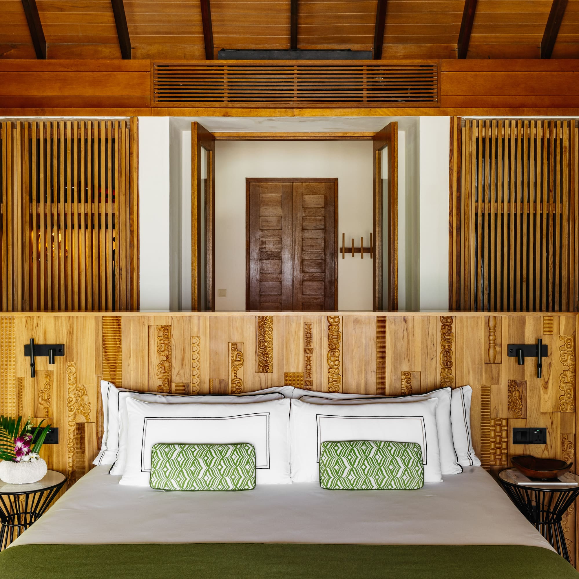 a bed with a wood headboard