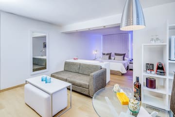 a room with a couch and a bed