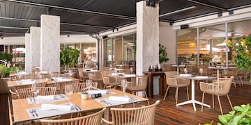 a restaurant with tables and chairs
