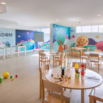 a room with tables and chairs