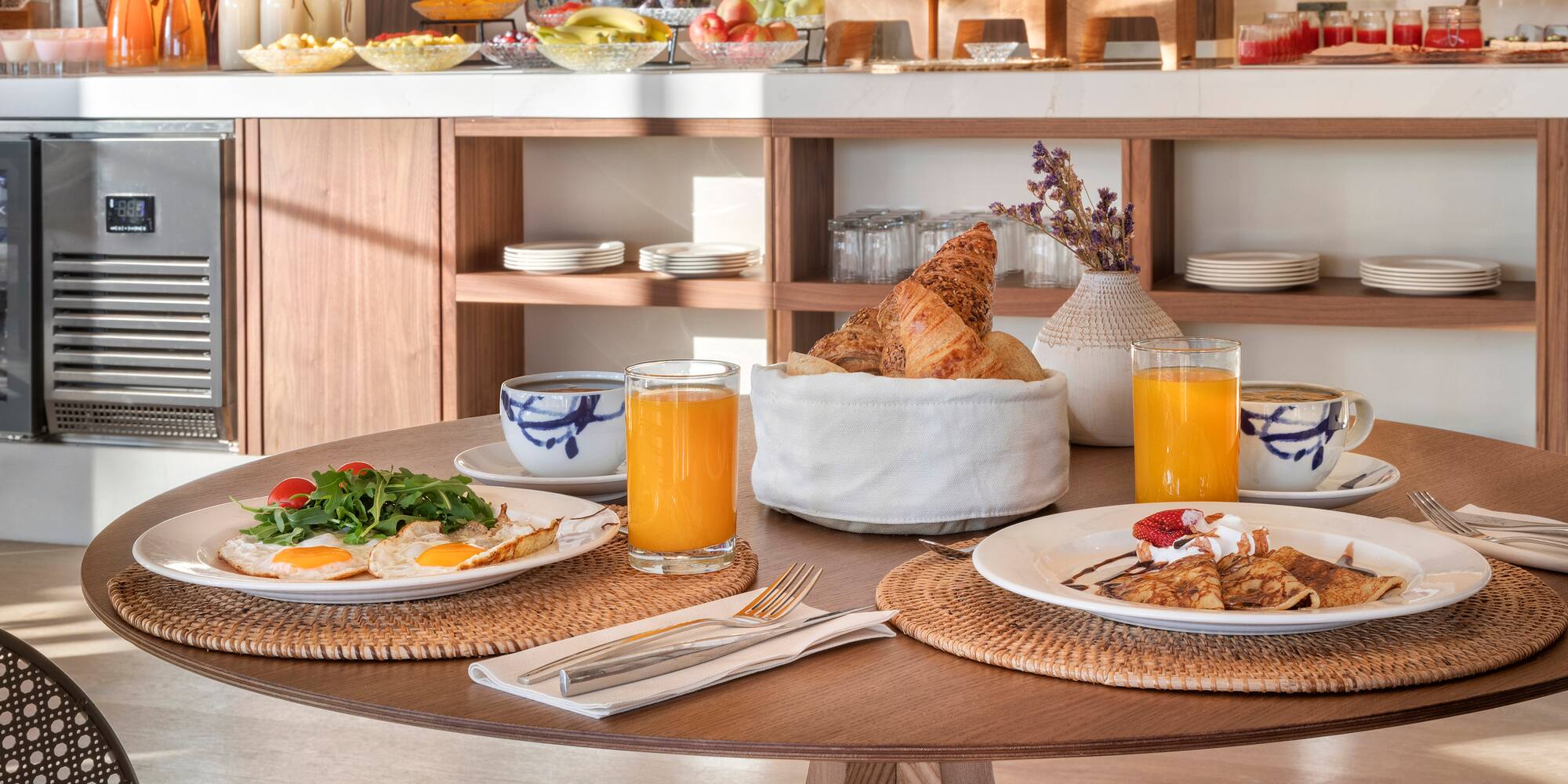 a table with plates of food and drinks