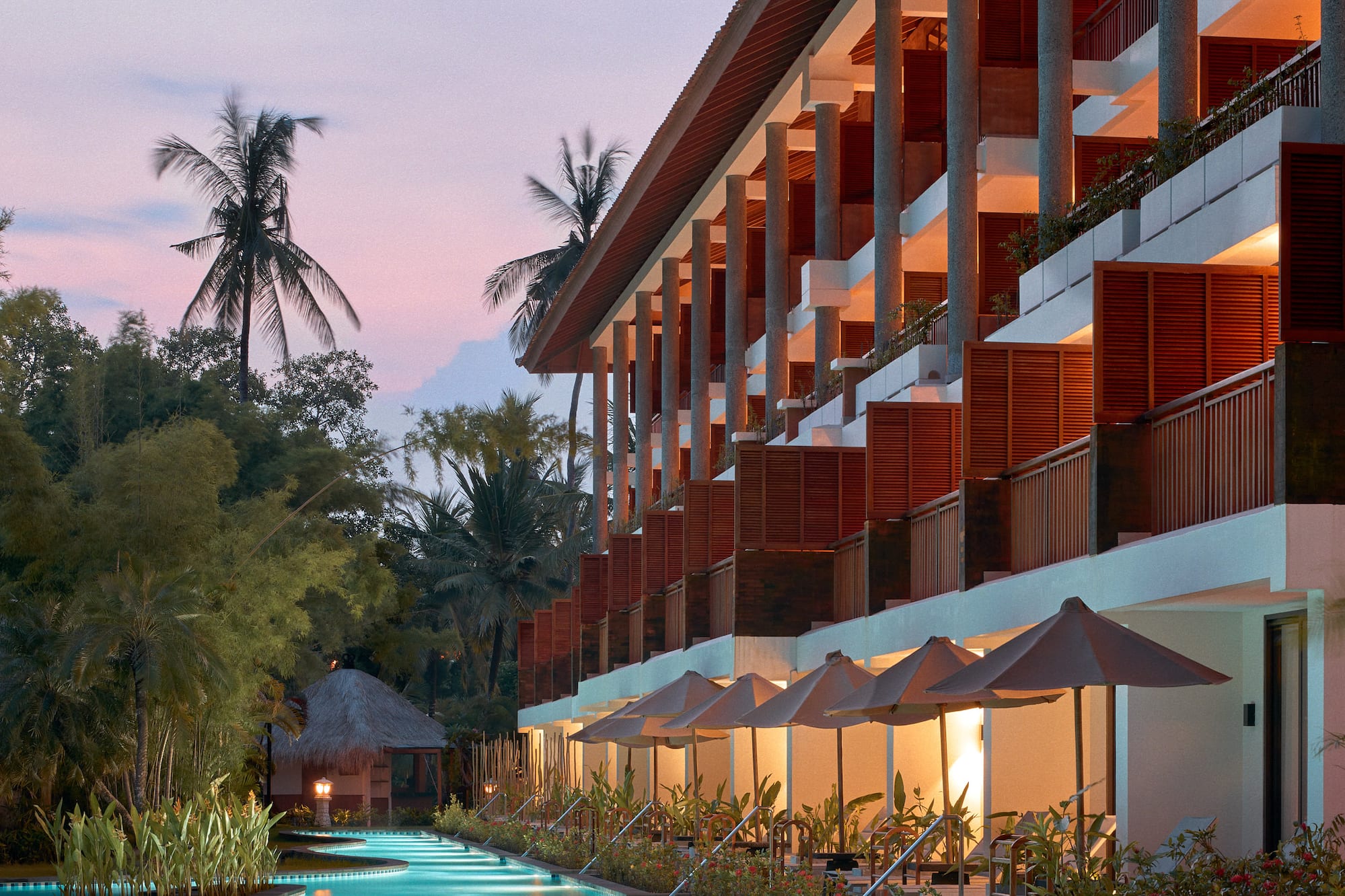 a pool with a building and trees