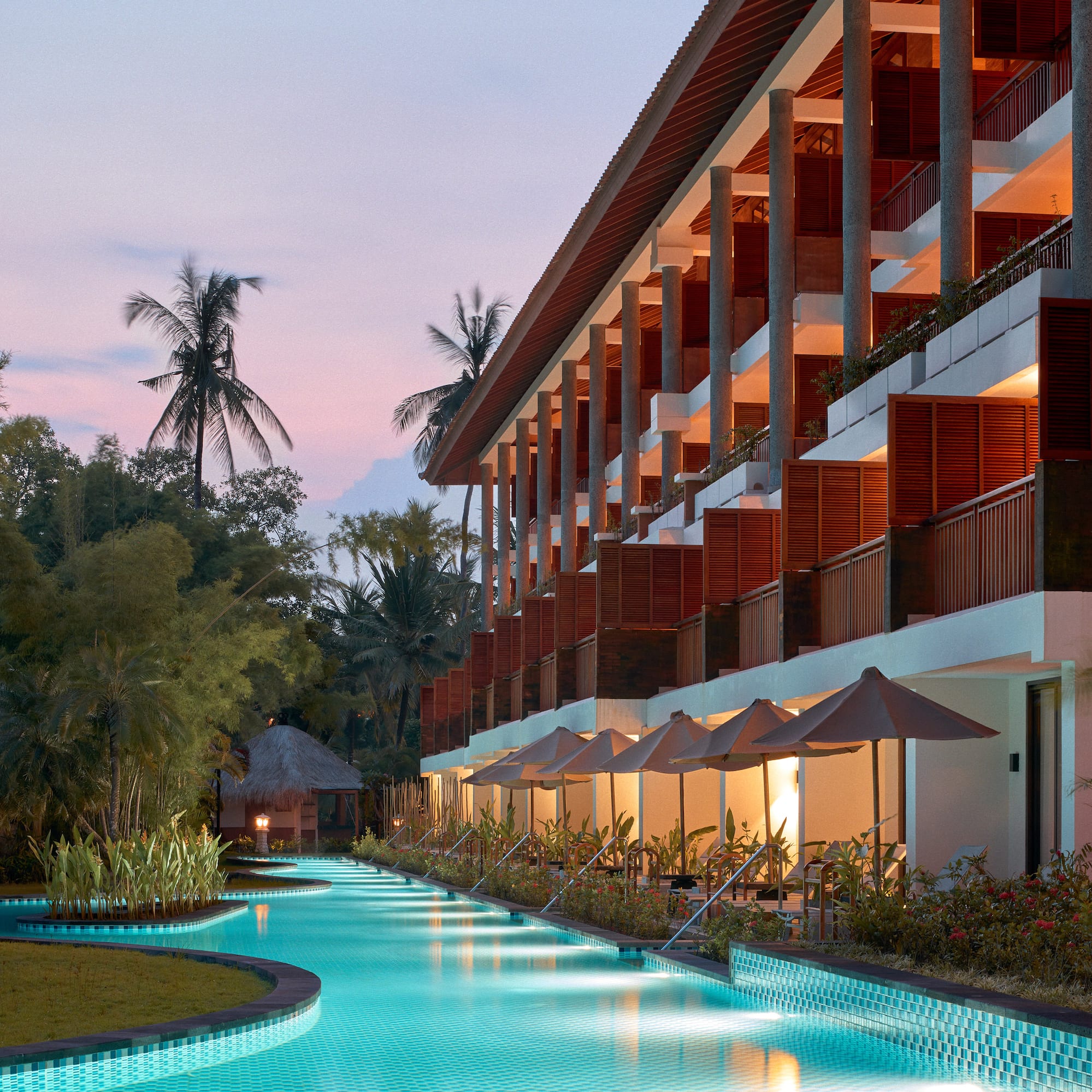 a pool with a building and trees