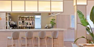 a bar with chairs and a counter