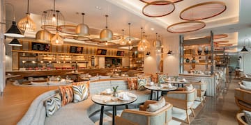 a restaurant with tables and chairs