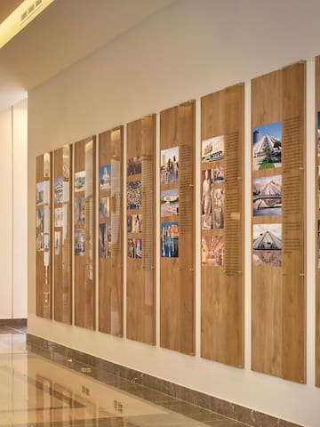 a long wall with pictures on it