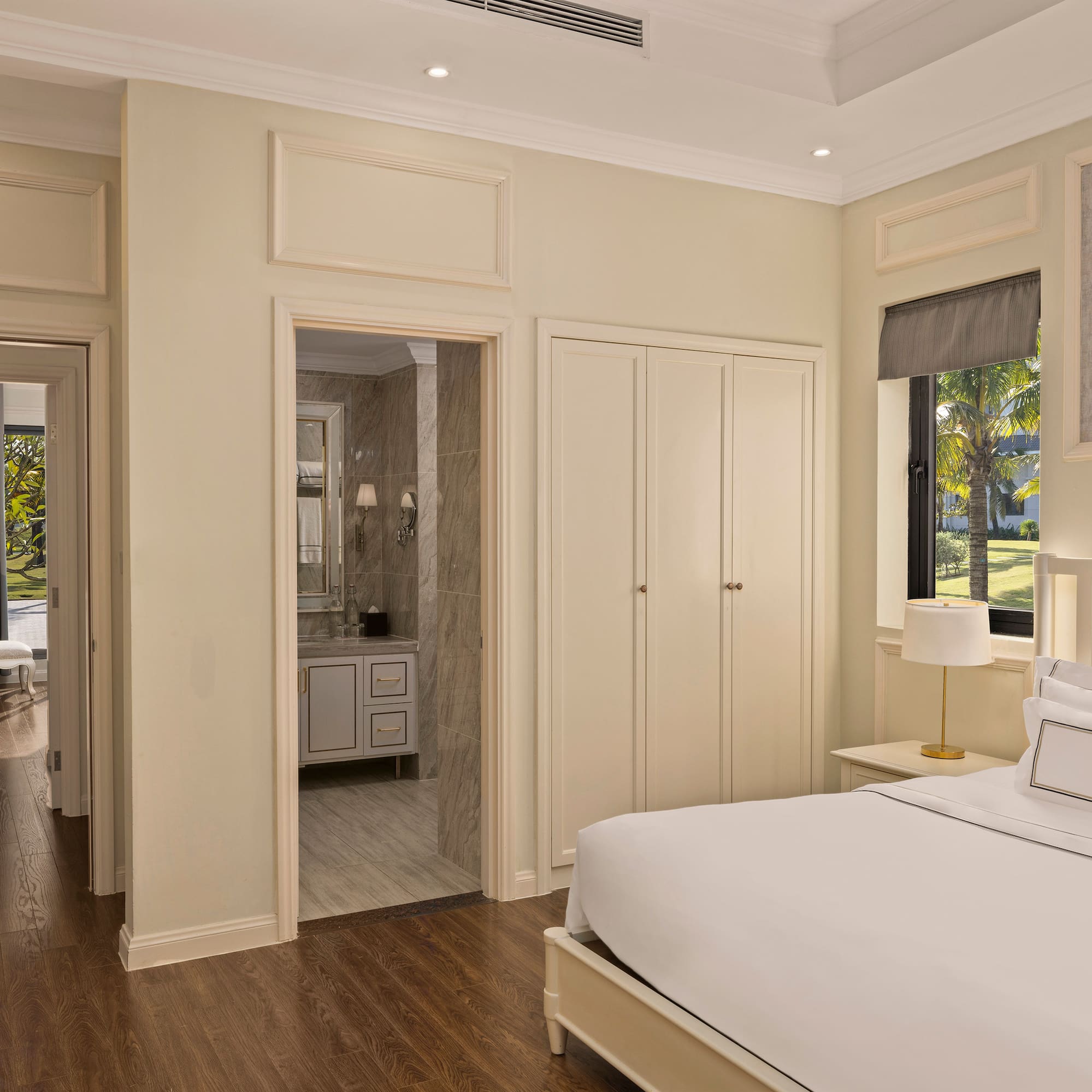 a bedroom with a bed and a mirror