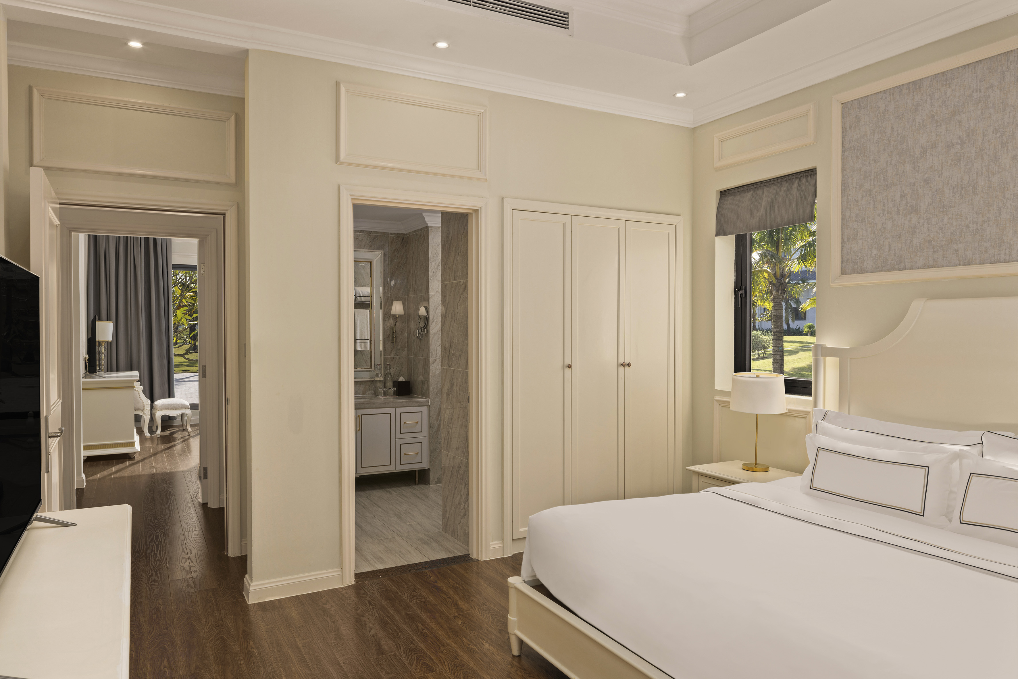 a bedroom with a bed and a mirror