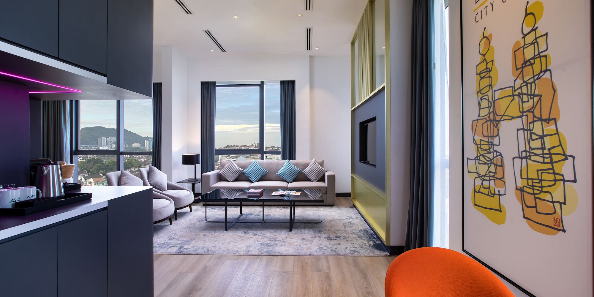 a living room with a couch and a painting