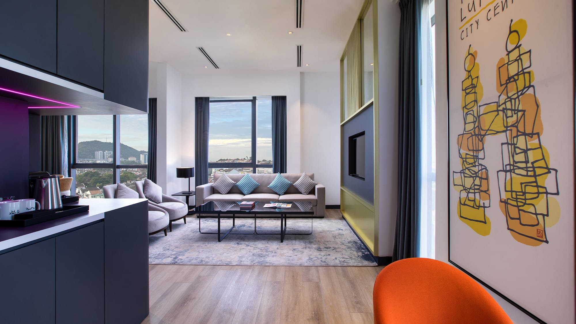 a living room with a couch and a painting