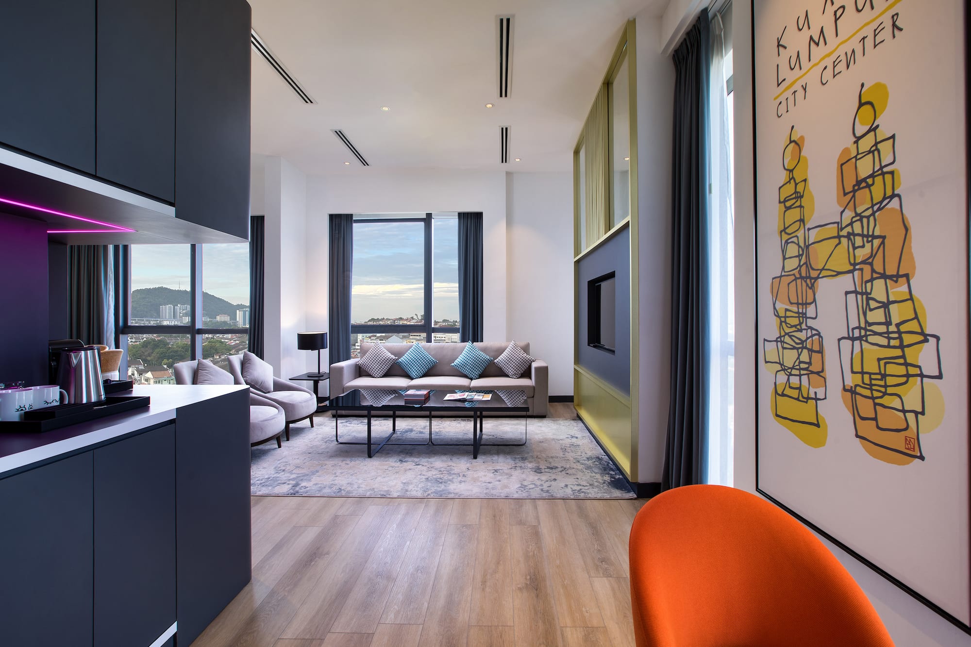 a living room with a couch and a painting