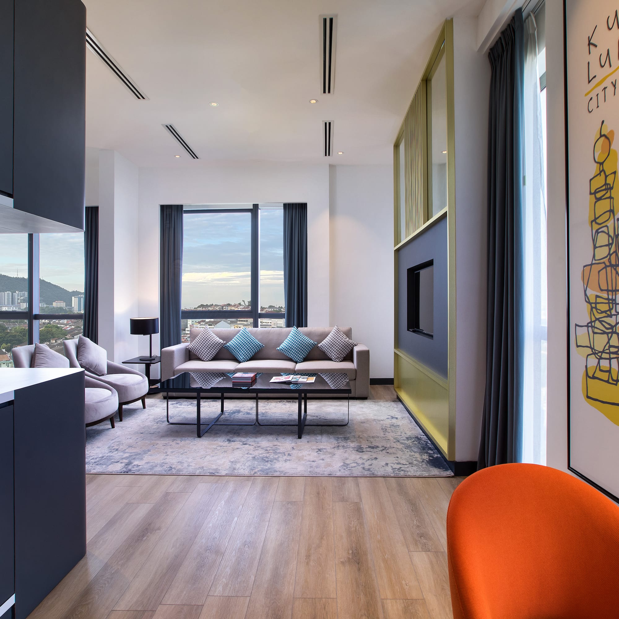 a living room with a couch and a painting