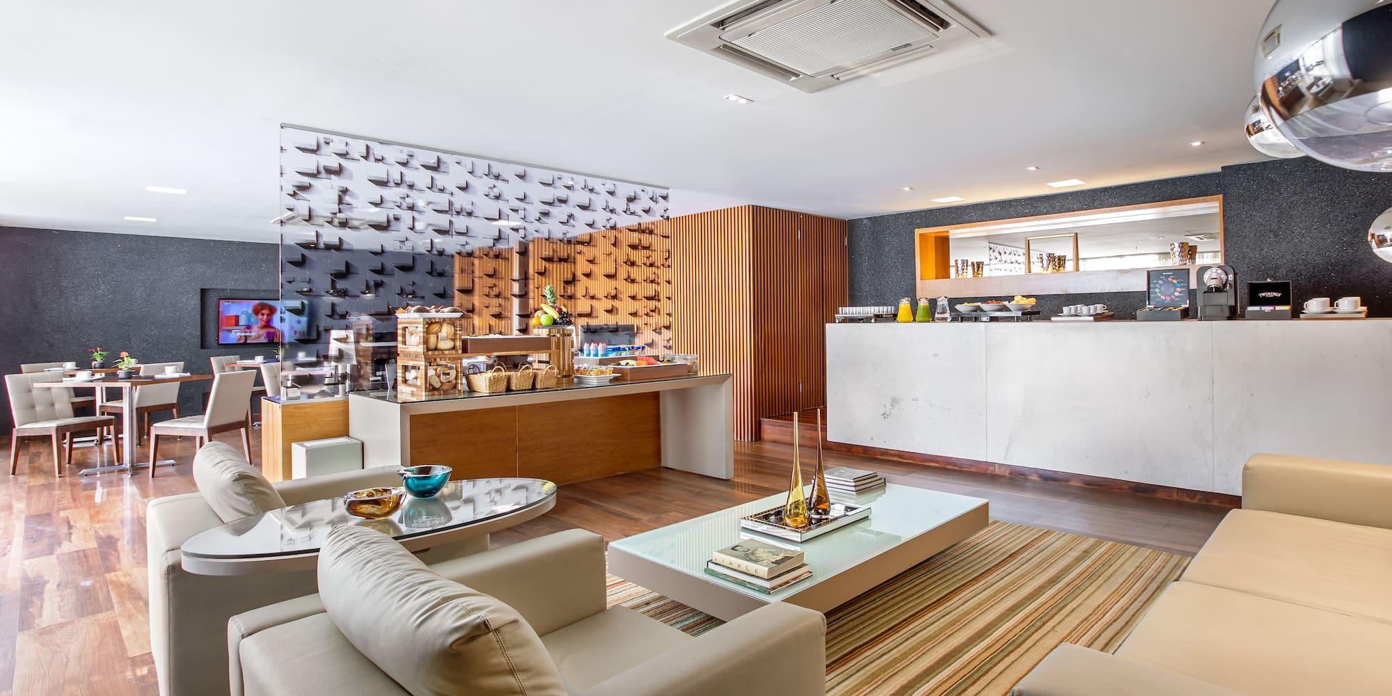 a room with a counter and a table and chairs