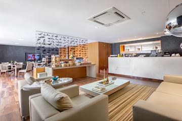 a room with a counter and a table and chairs