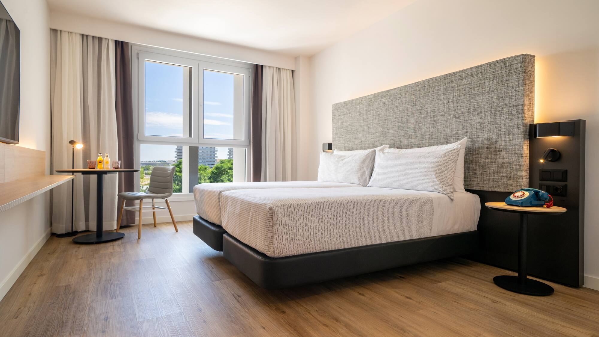 a bedroom with a bed and a table