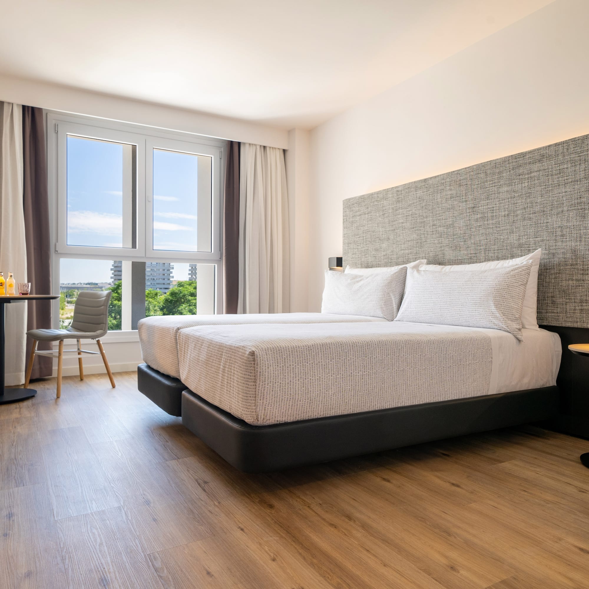 a bedroom with a bed and a table