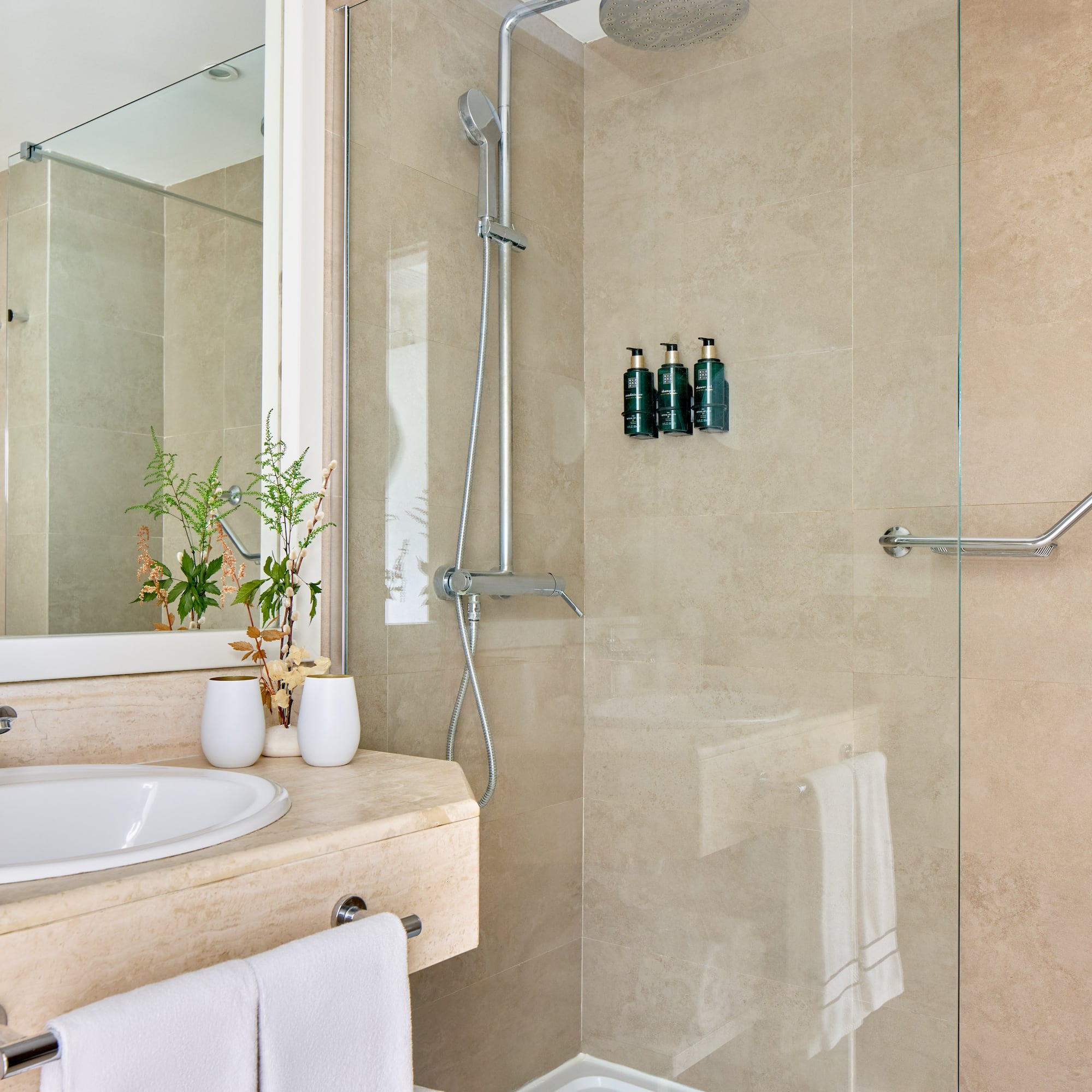 a bathroom with a shower and sink