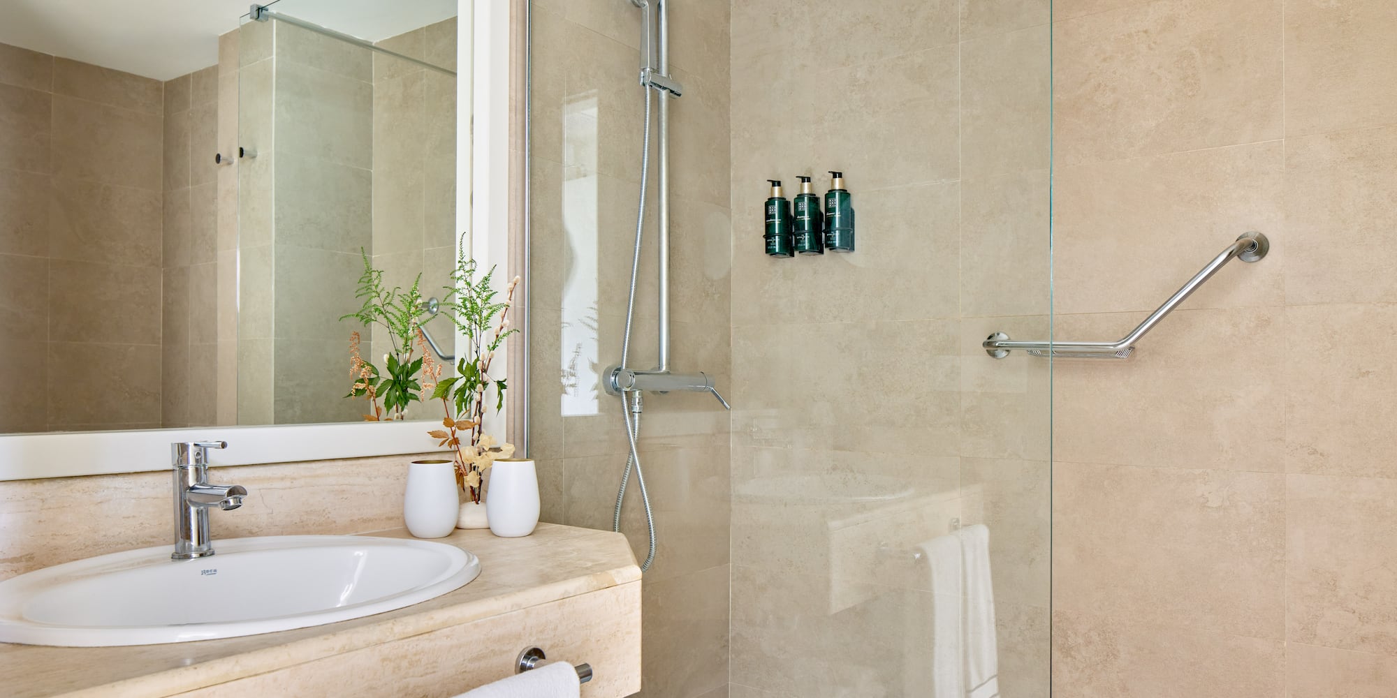 a bathroom with a shower and sink