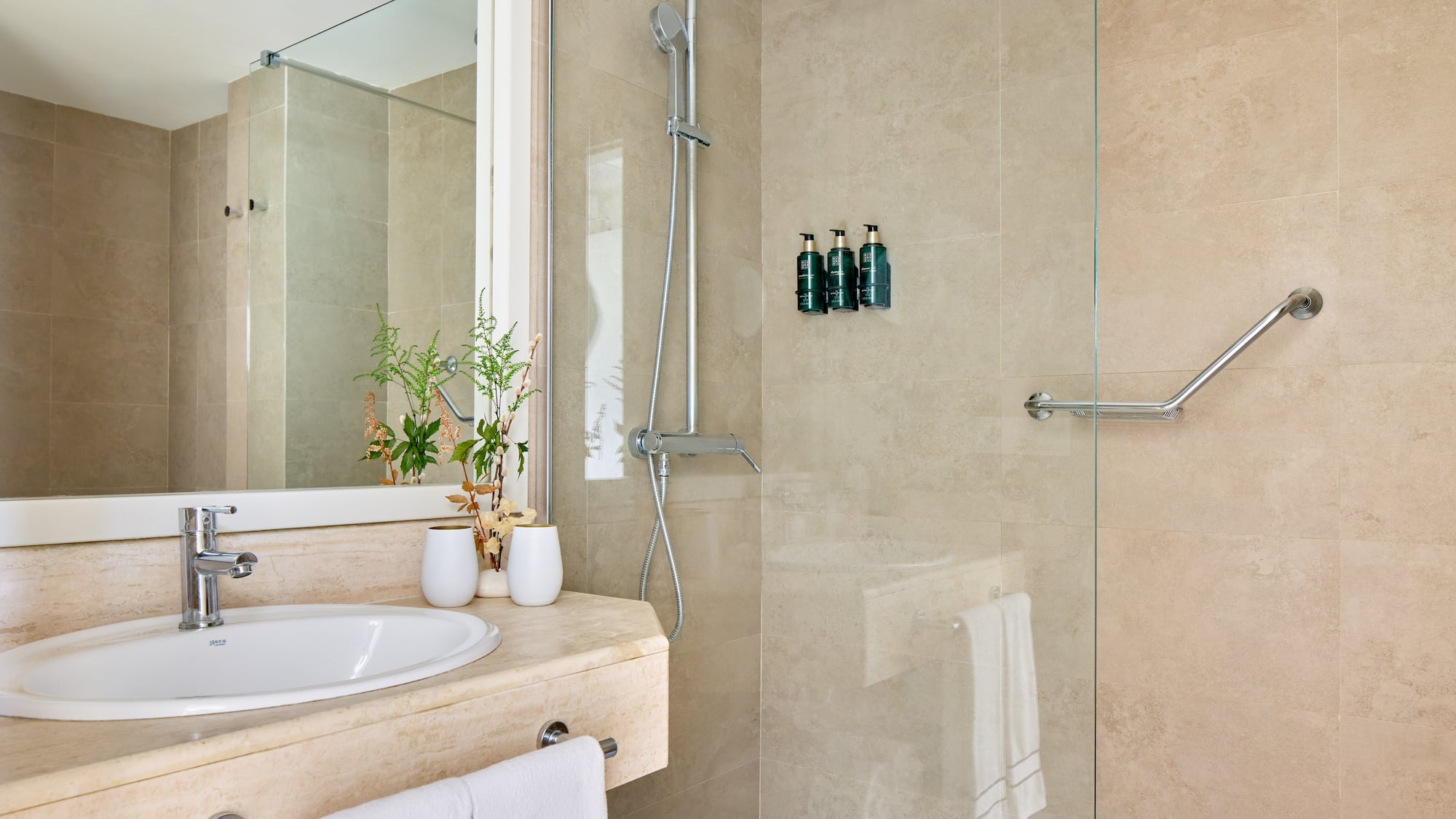 a bathroom with a shower and sink