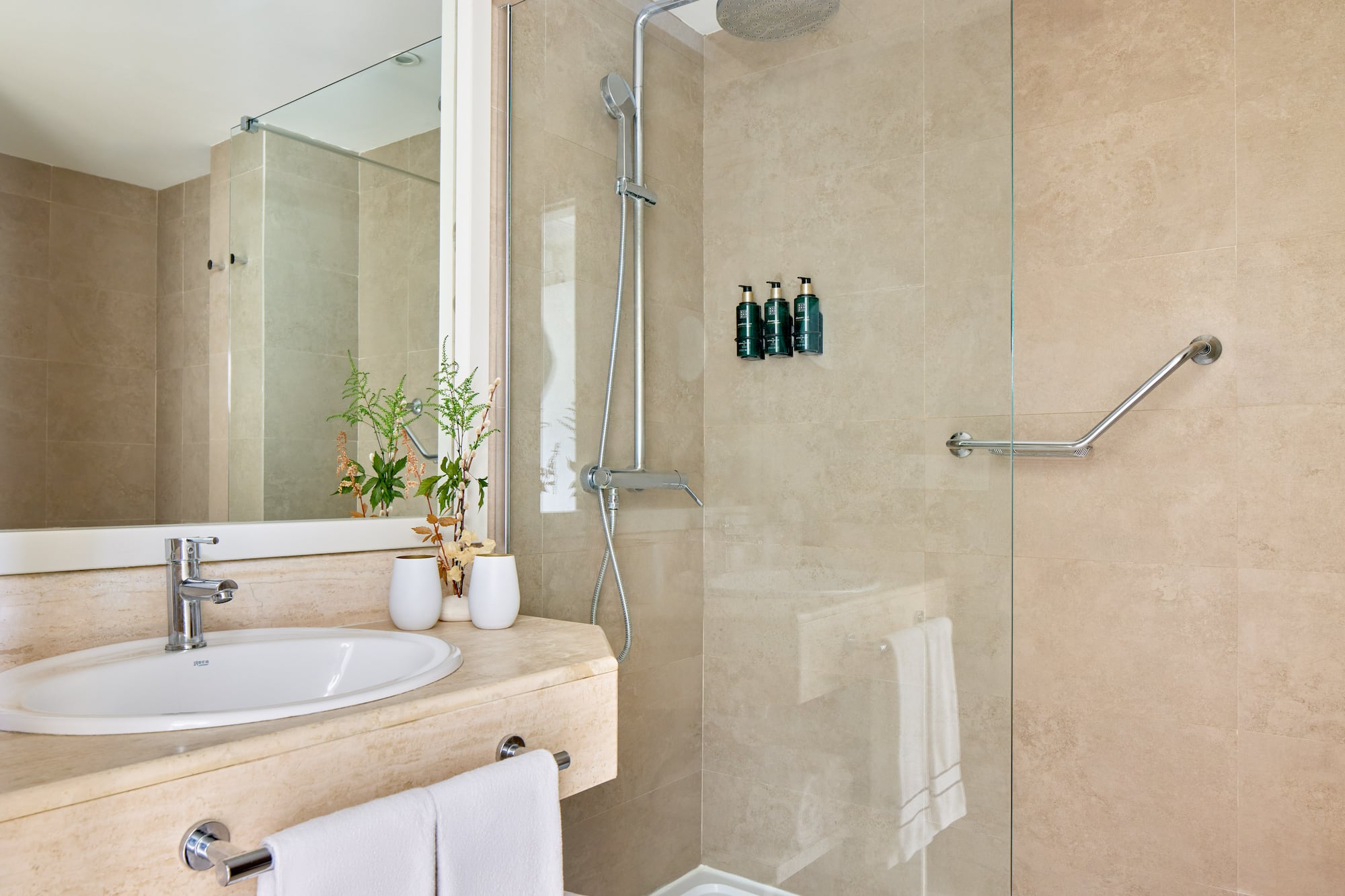 a bathroom with a shower and sink