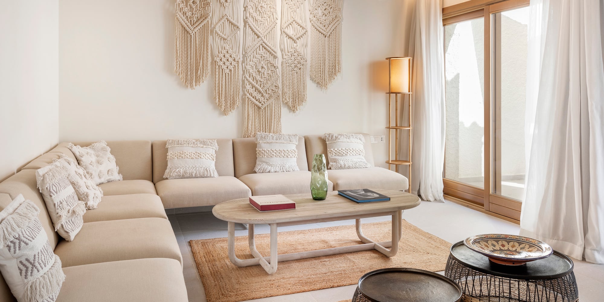 a living room with a large couch and coffee table