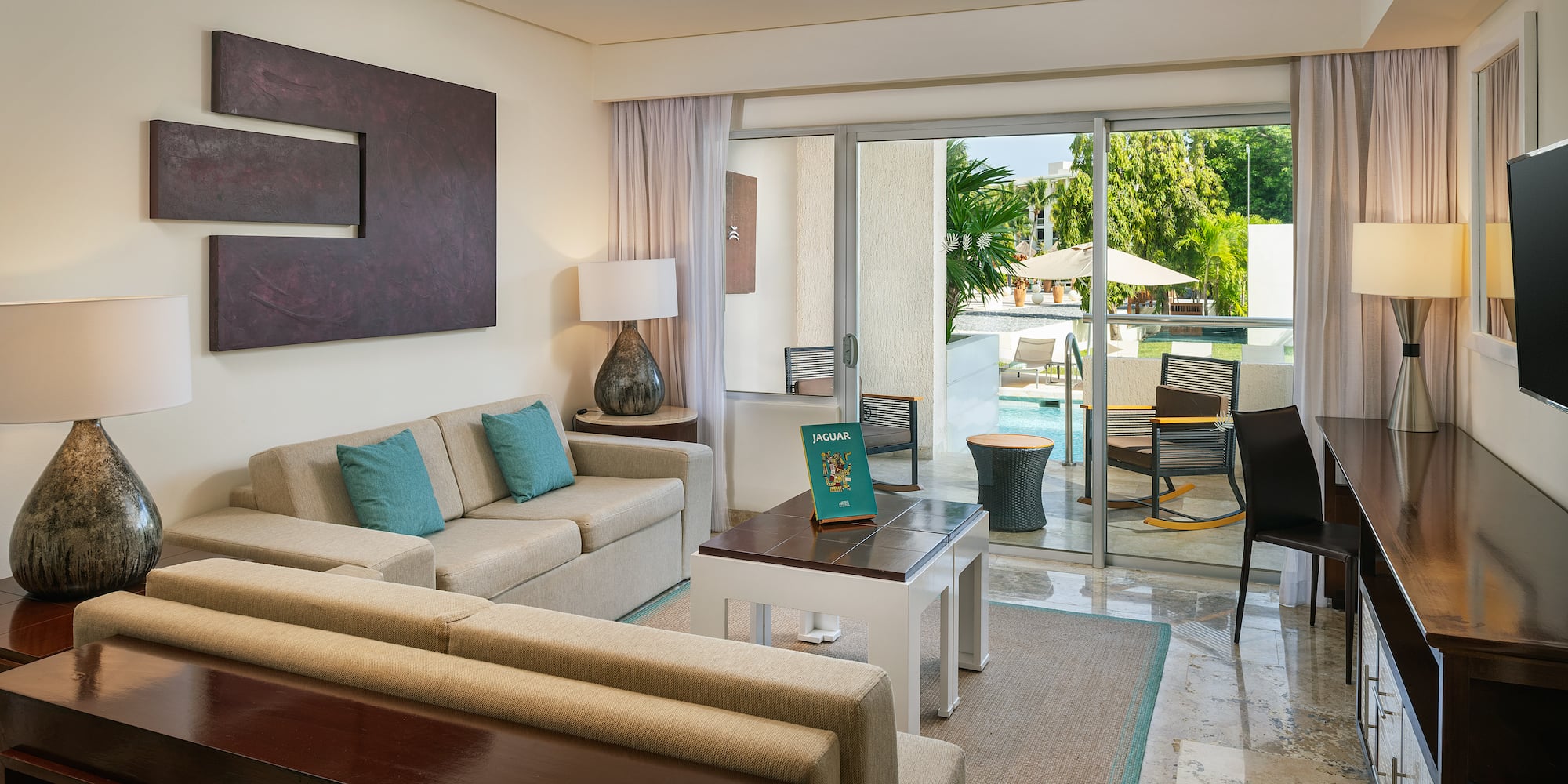 a living room with a glass door and a couch