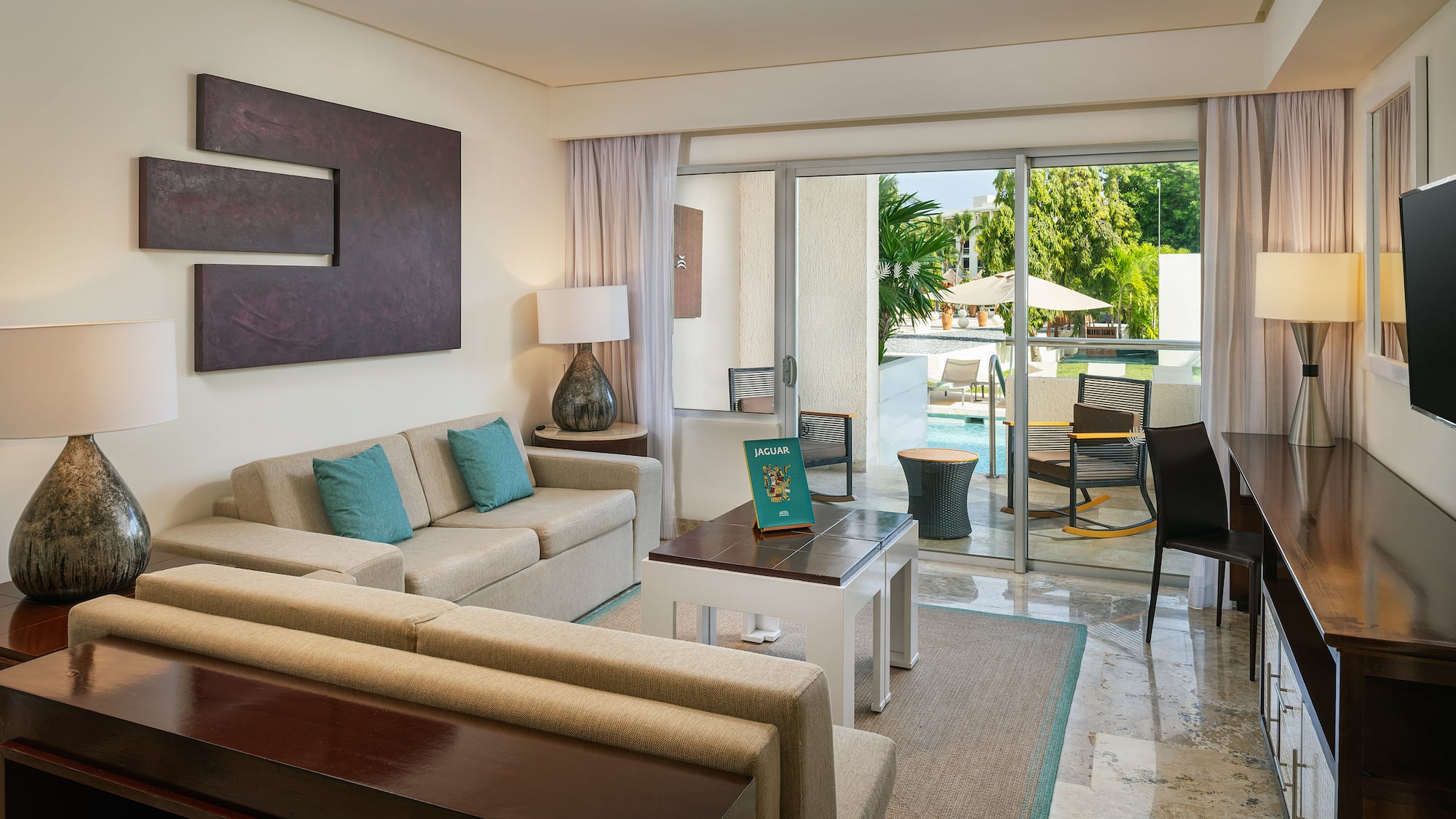 a living room with a glass door and a couch