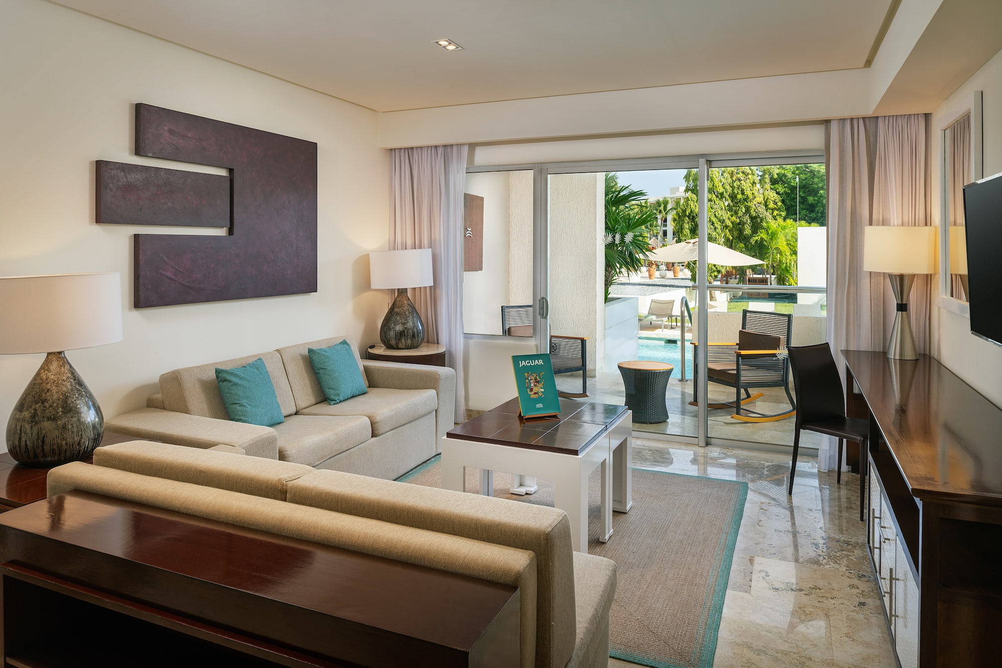 a living room with a glass door and a couch