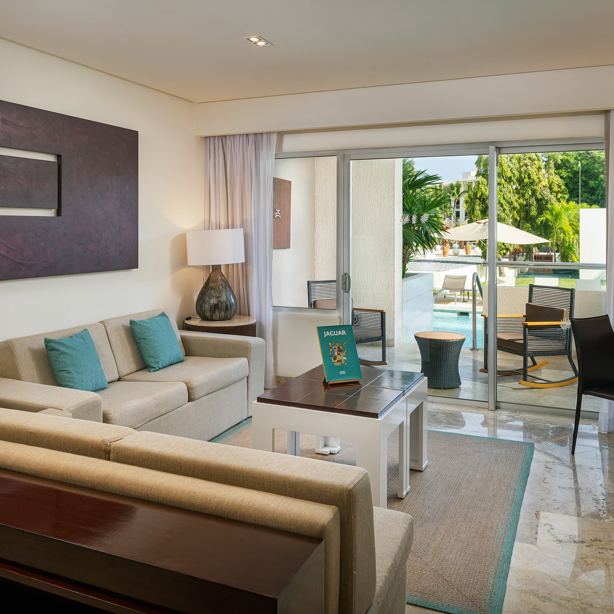 a living room with a glass door and a couch