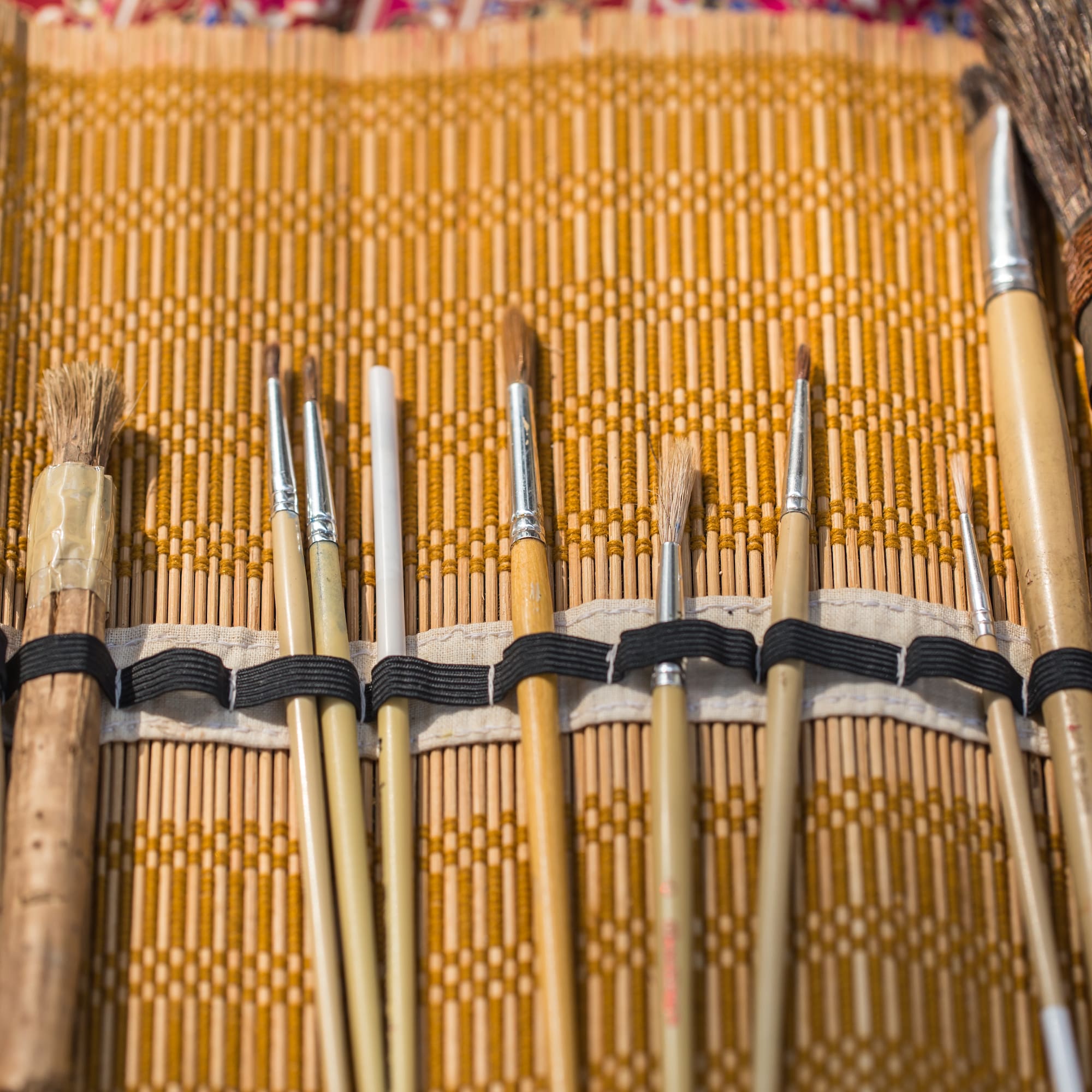 a group of brushes in a case