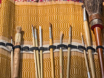 a group of brushes in a case