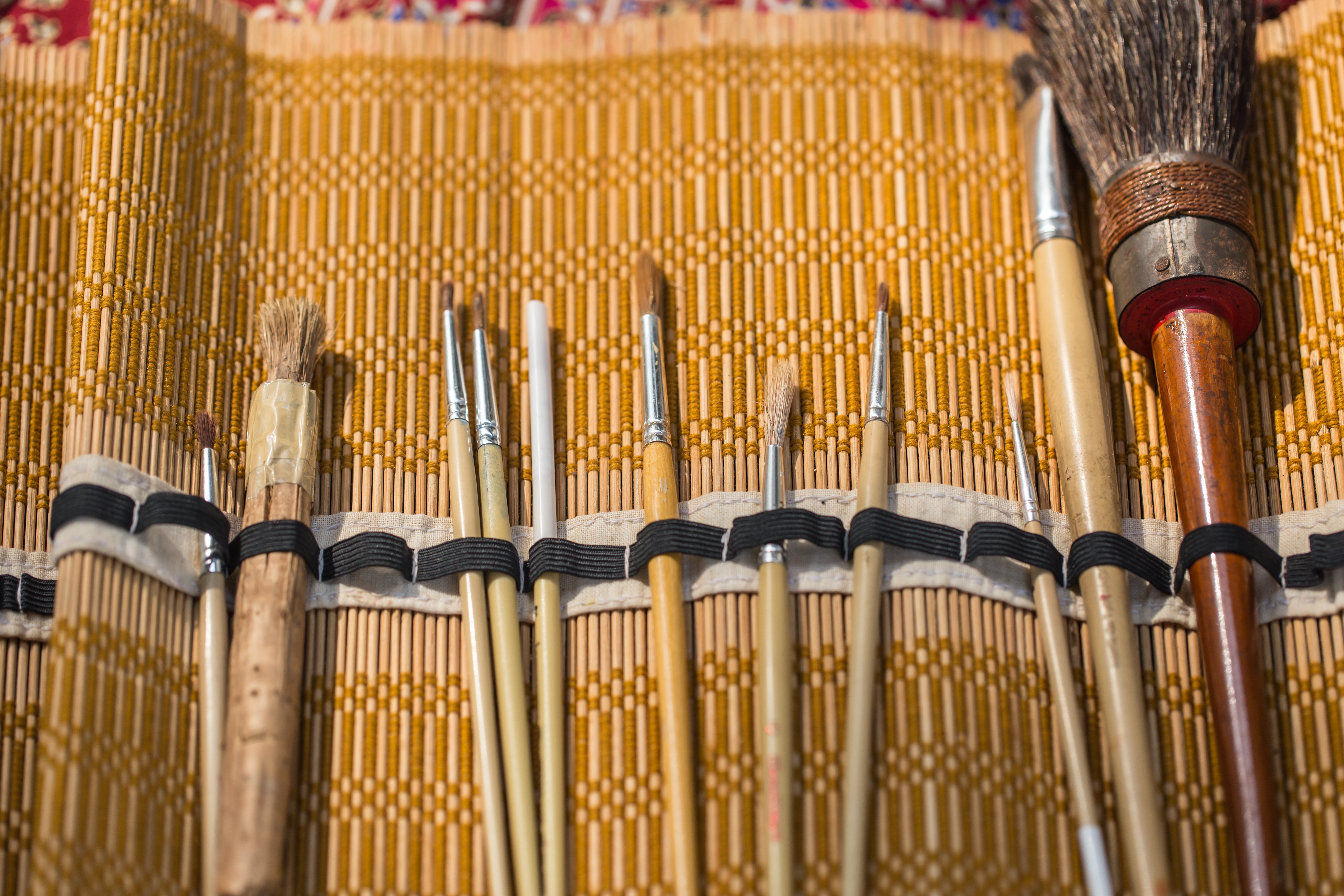 a group of brushes in a case