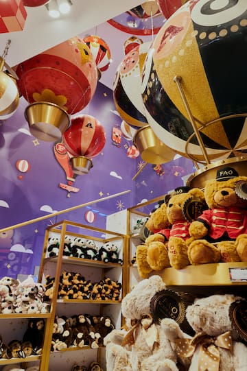 a stuffed animals and balloons in a store
