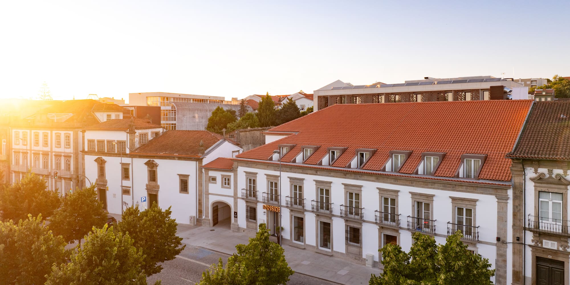 a group of buildings with trees