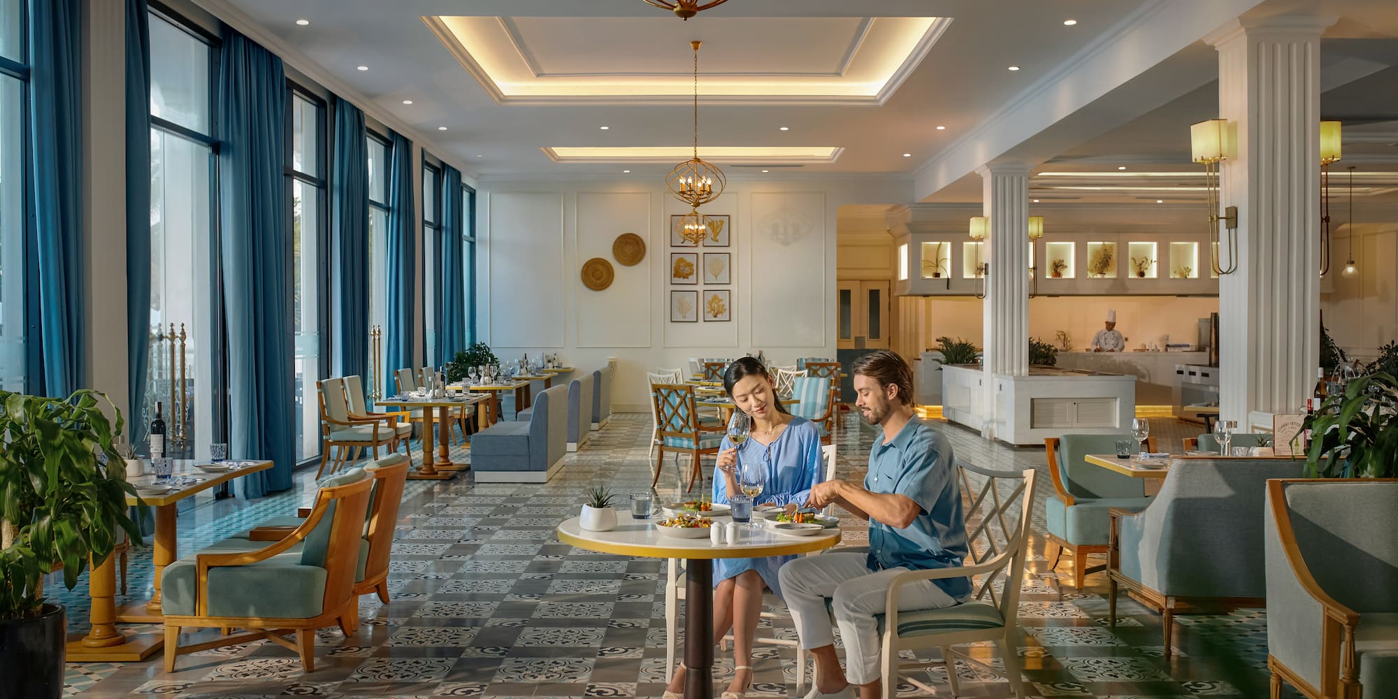 a man and woman sitting at a table in a restaurant