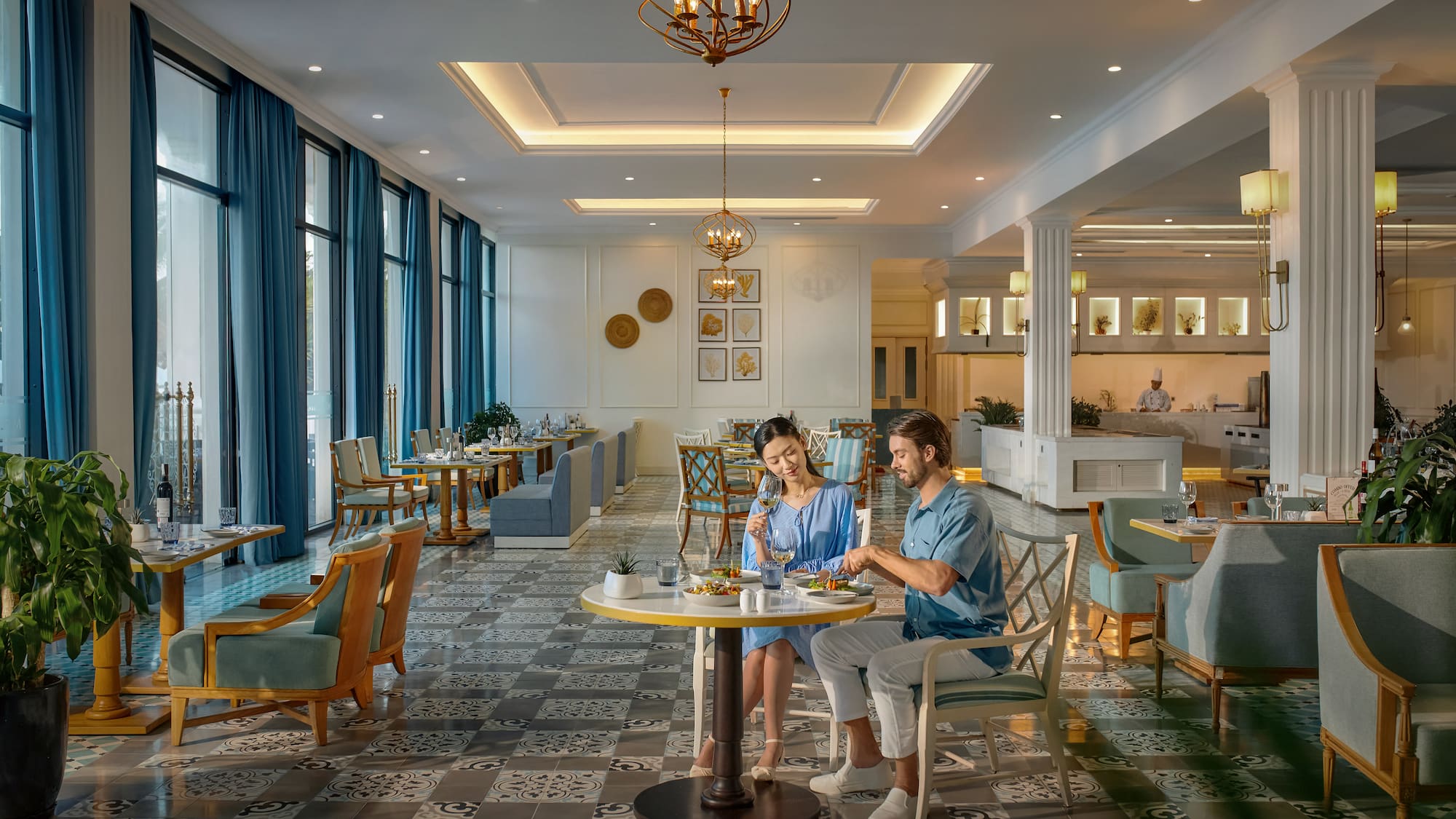 a man and woman sitting at a table in a restaurant