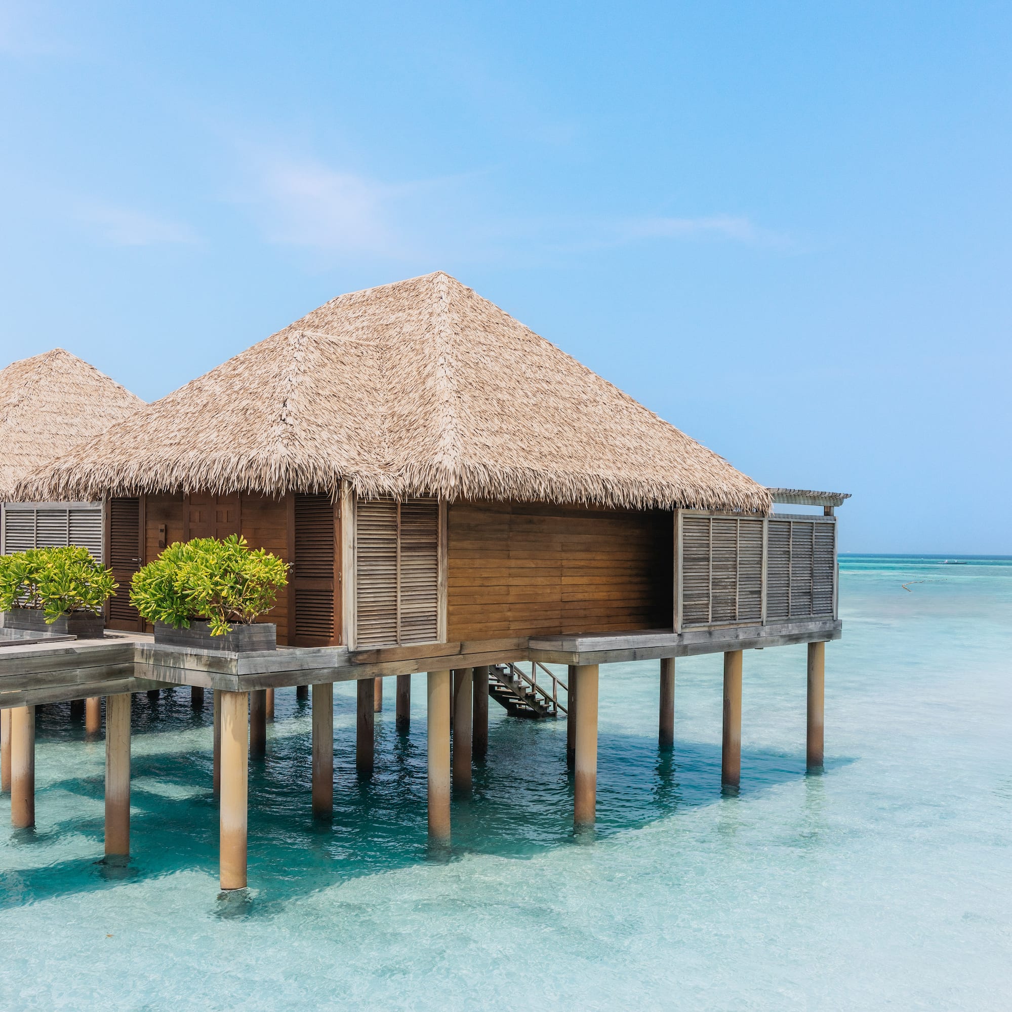 a building on stilts in the water
