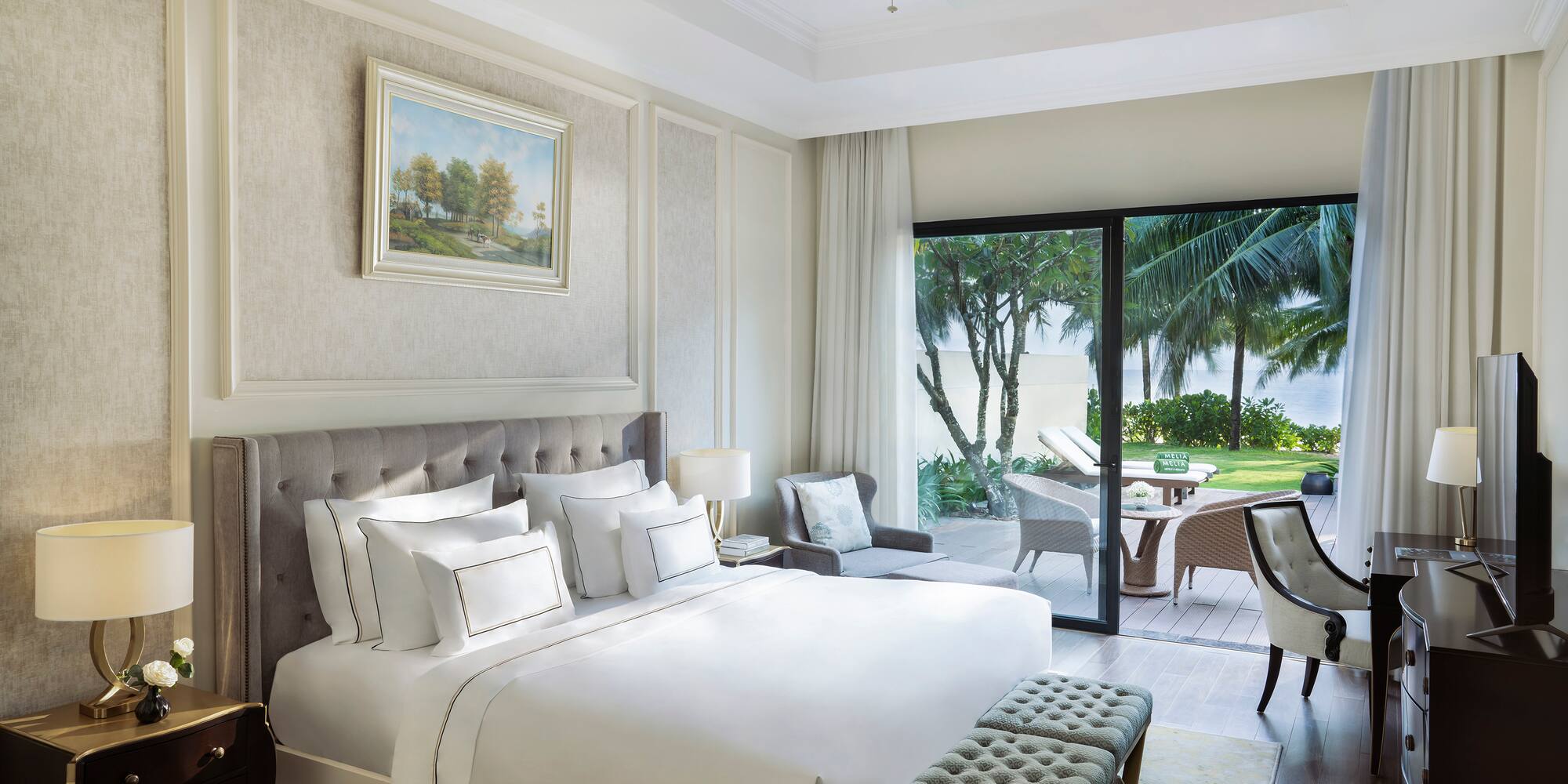 a bedroom with a bed and a patio door