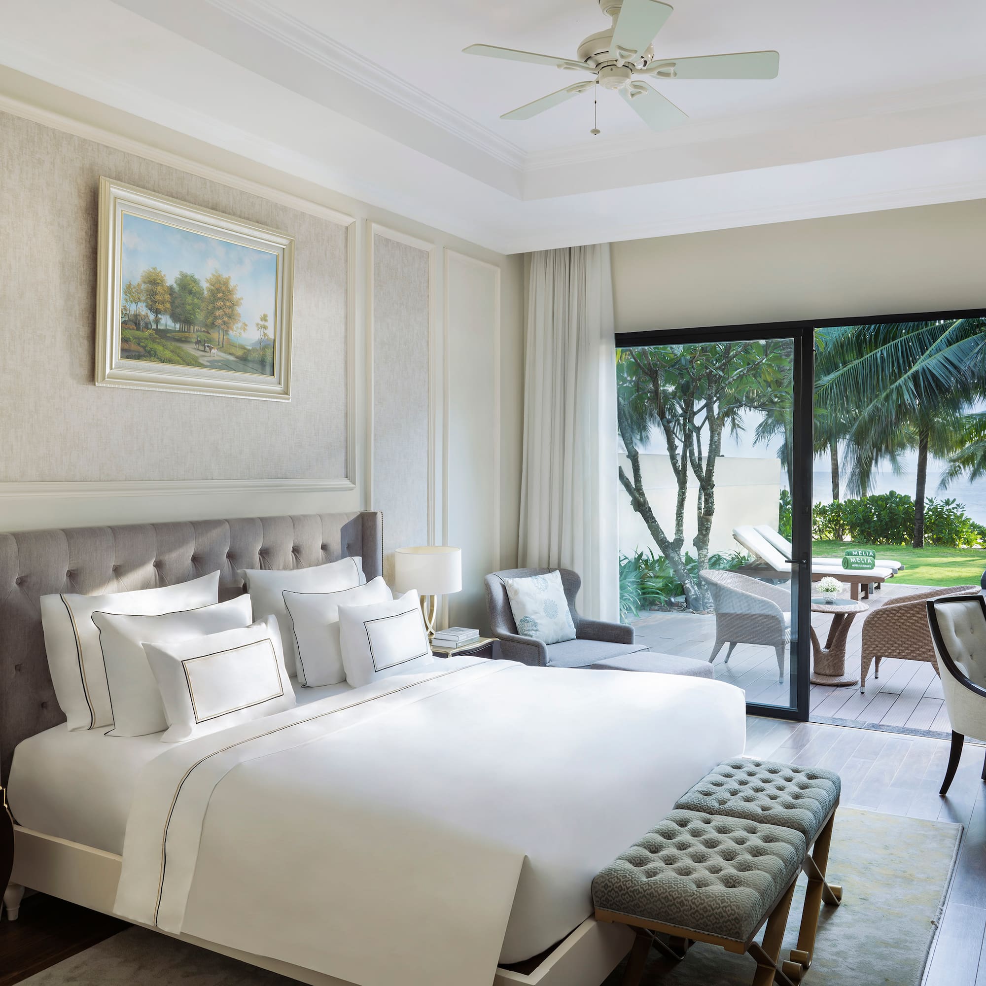 a bedroom with a bed and a patio door