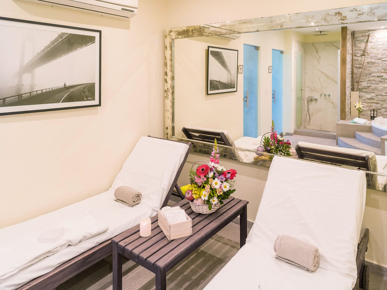 a room with chairs and a mirror