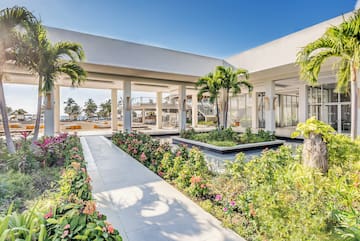 a building with a garden and plants