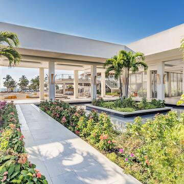 a building with a garden and plants