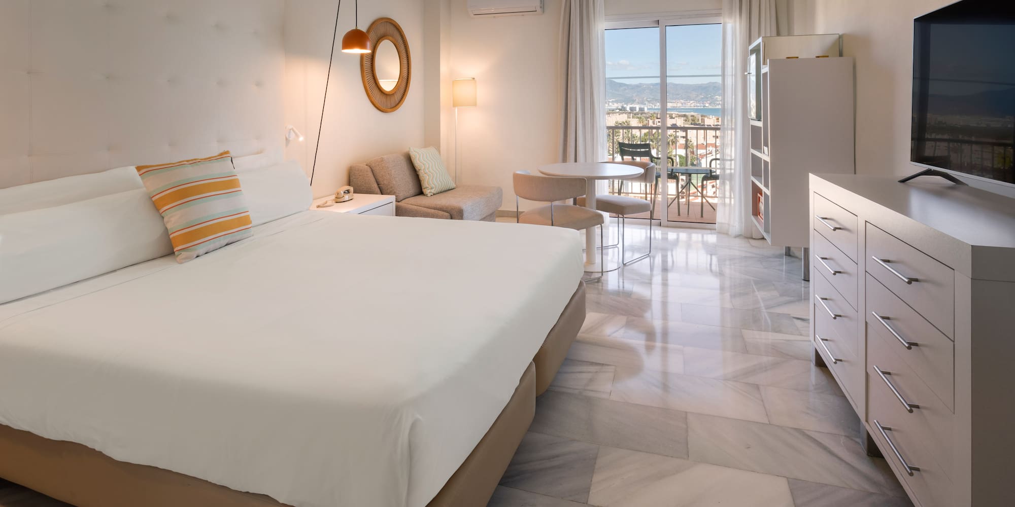 a bedroom with a bed and a table