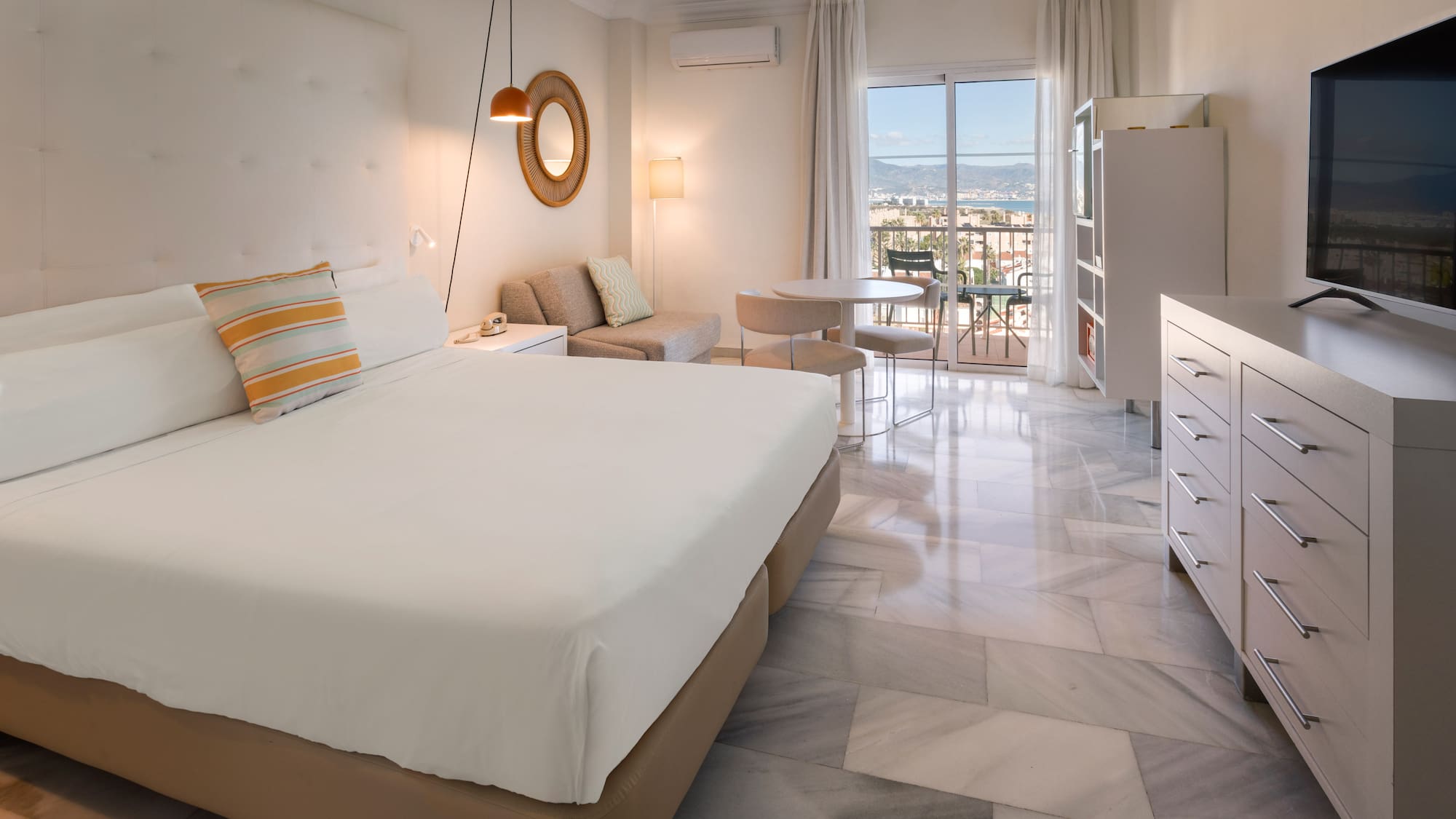 a bedroom with a bed and a table