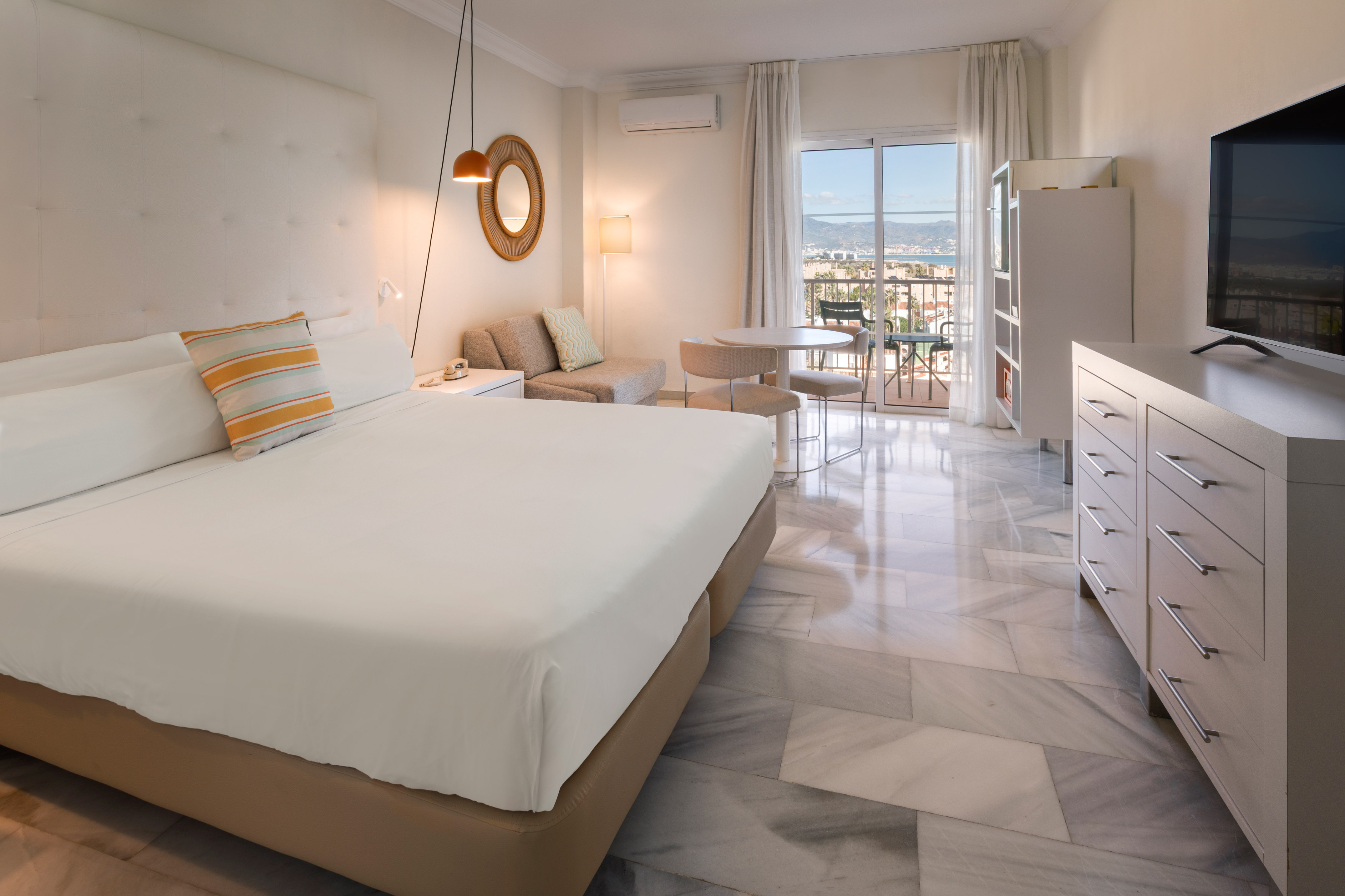 a bedroom with a bed and a table