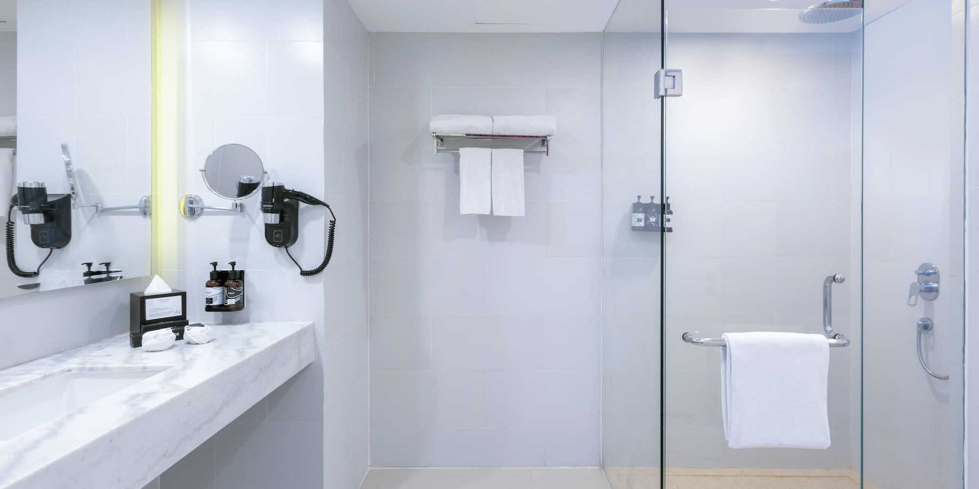 a bathroom with a glass shower door