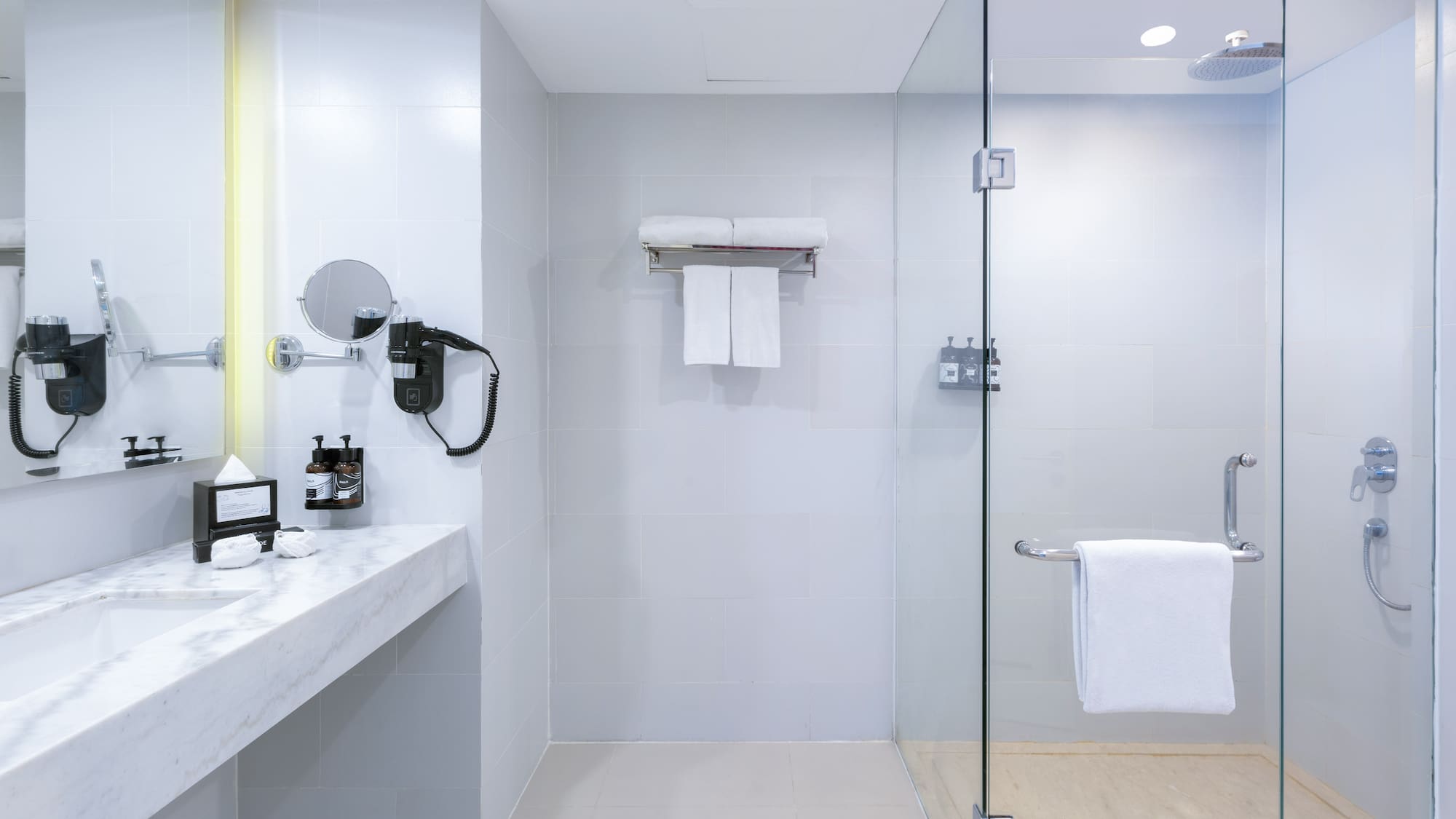 a bathroom with a glass shower door