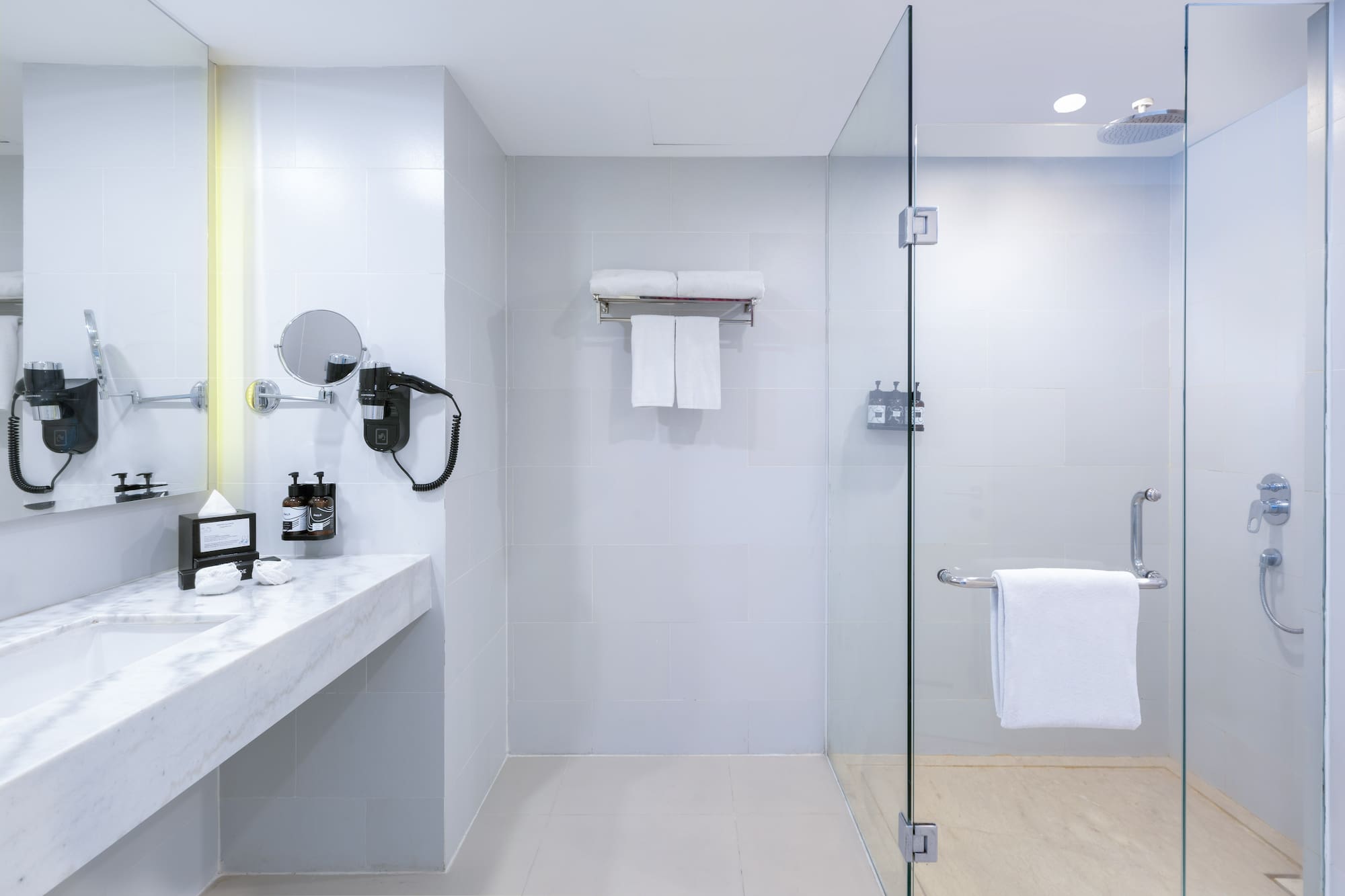 a bathroom with a glass shower door