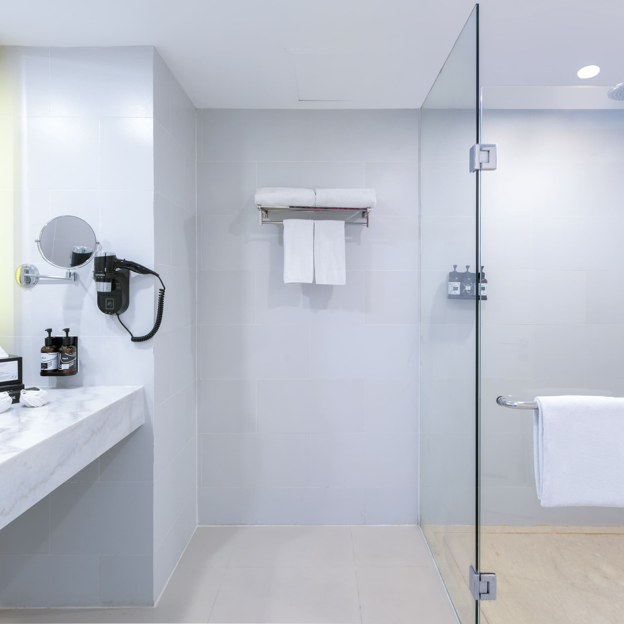 a bathroom with a glass shower door