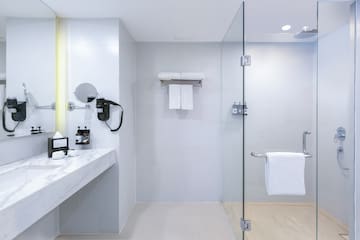a bathroom with a glass shower door